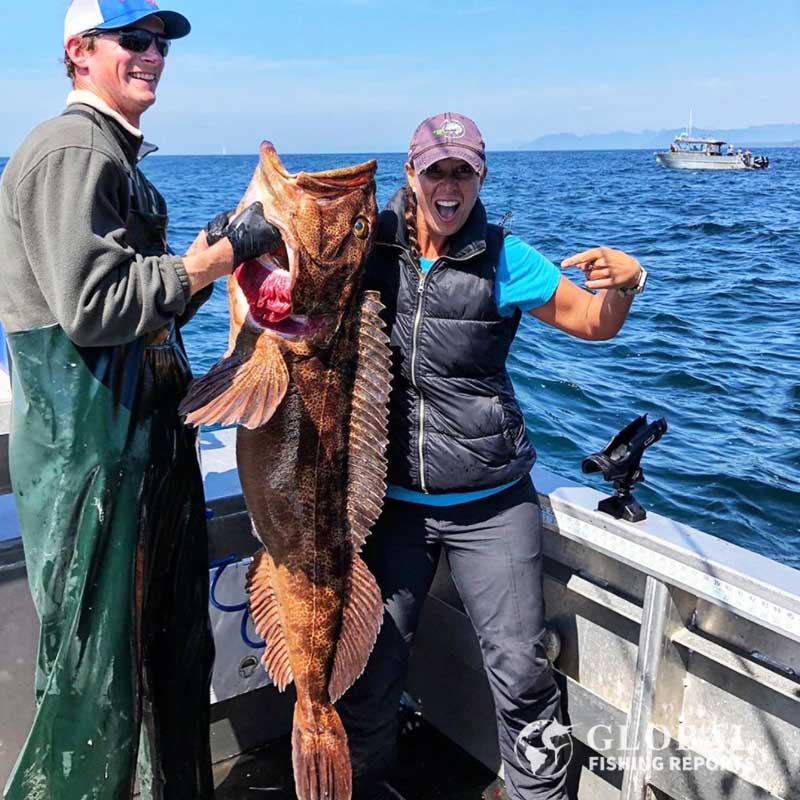 Captain Cody and fishing client with a large ling cod